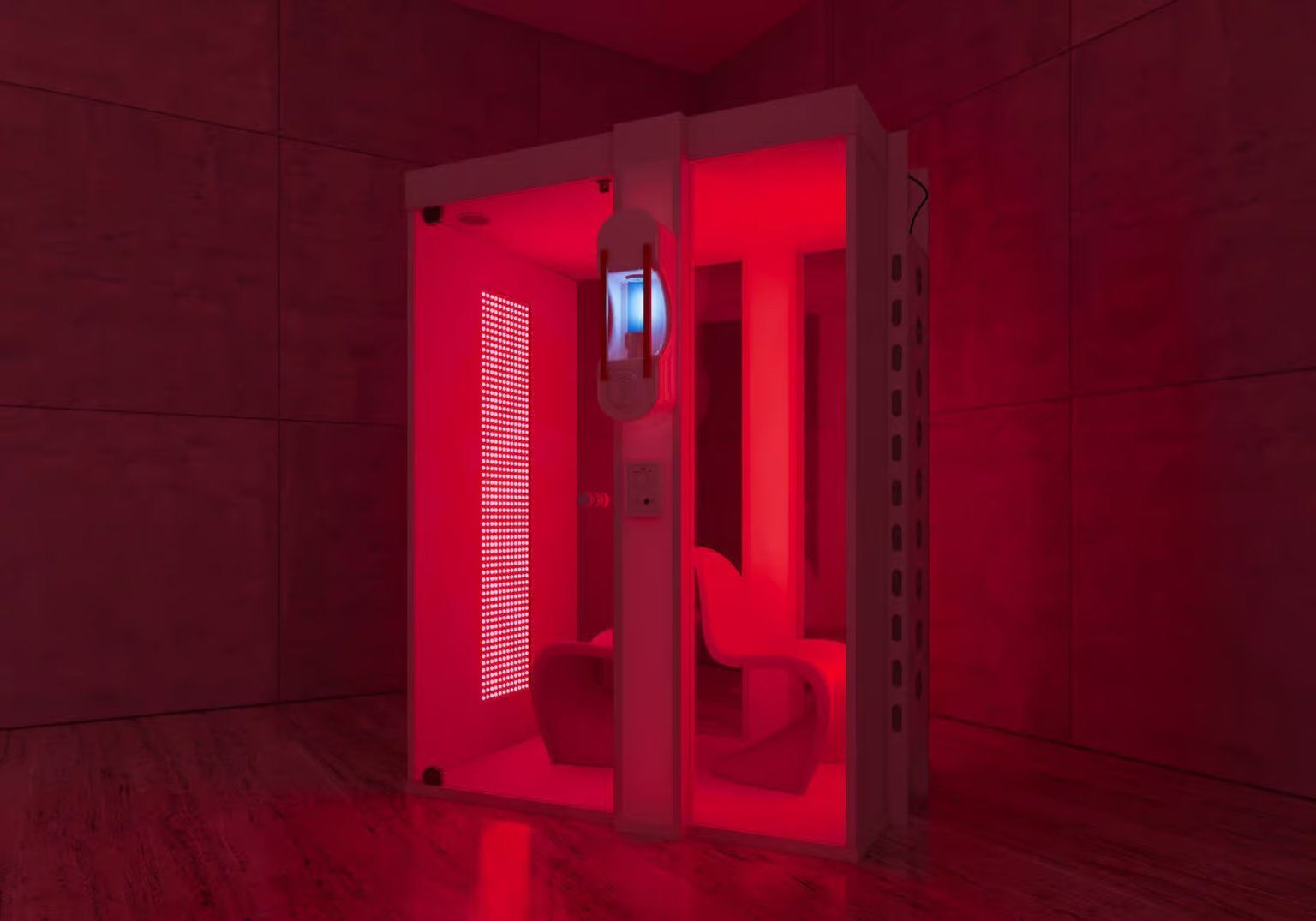 Salz- und Rotlichtkabine mit rot leuchtenden Panels und Sitz in einem abgedunkelten Raum